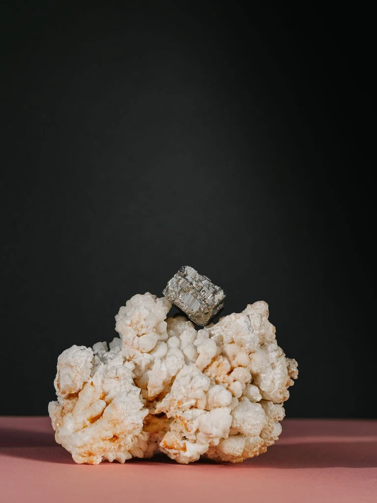 Natural pyrite cube cluster on grey matrix with metallic cubic crystal faces