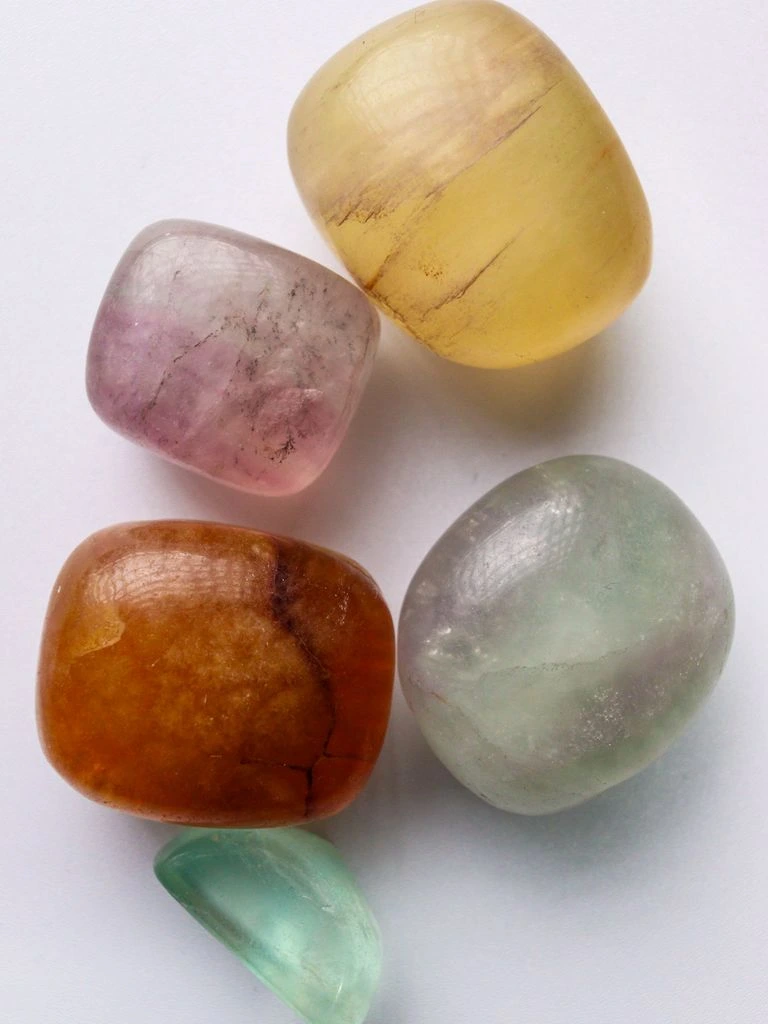 Translucent green and purple fluorite crystals on dark sphalerite matrix