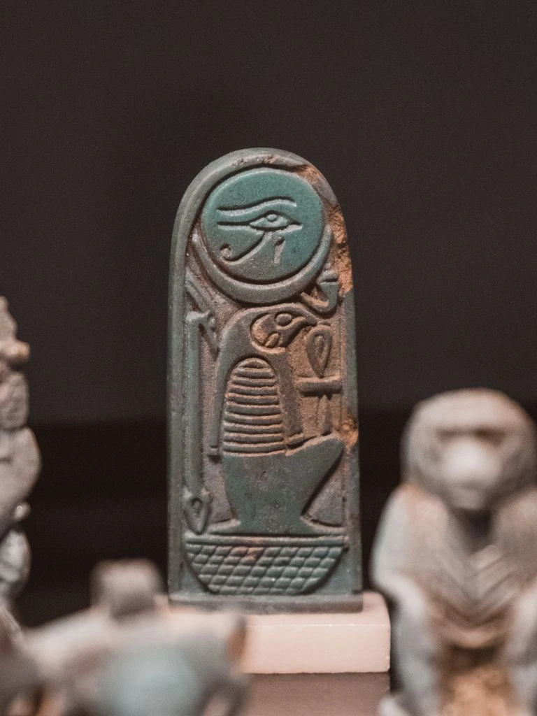 Turquoise-glazed Egyptian faience ushabti figurine with weathered glaze
